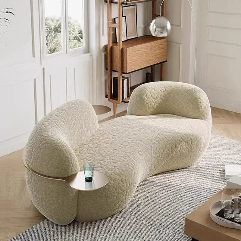 canape boucle beige courbe avec tablette ronde integree