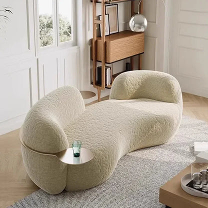 canape boucle beige courbe avec tablette ronde integree