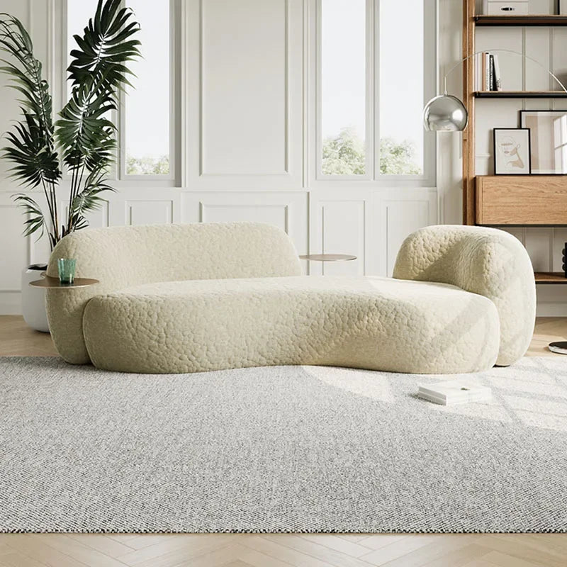 canape boucle creme courbe avec tablettes laterales