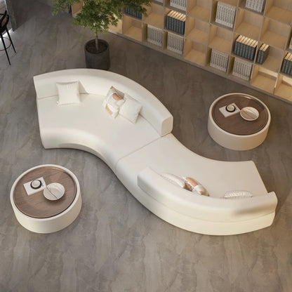 canape courbe blanc en S avec tables rondes