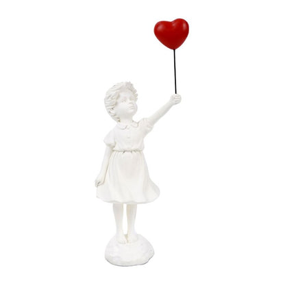 sculpture fillette blanche ballon rouge deco