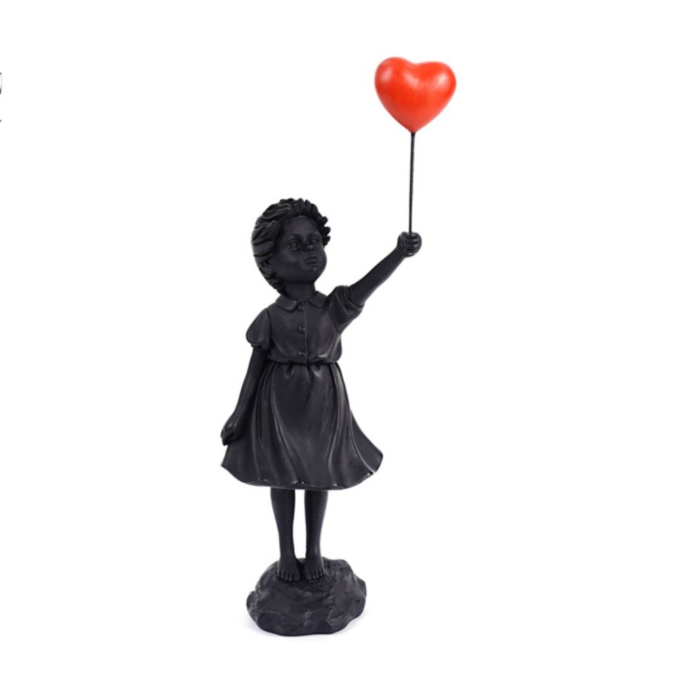 sculpture fillette noire ballon rouge 