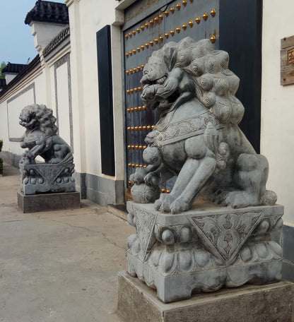 sculpture lions gardiens chinois en pierre 