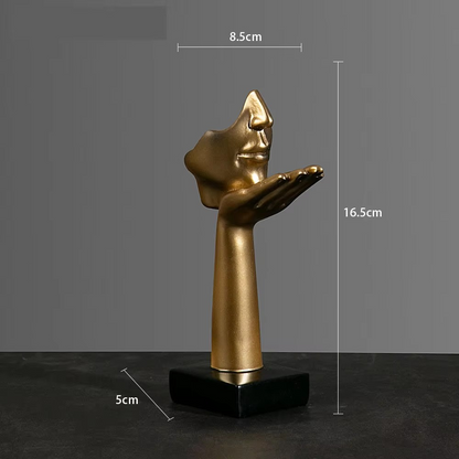 sculpture moitie visage abstrait dore