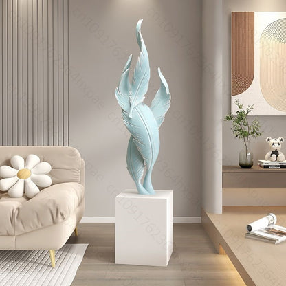 sculpture plumes turquoise sur socle blanc 