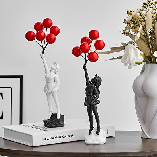 sculpture statues filles ballon rouge decor noir blanc