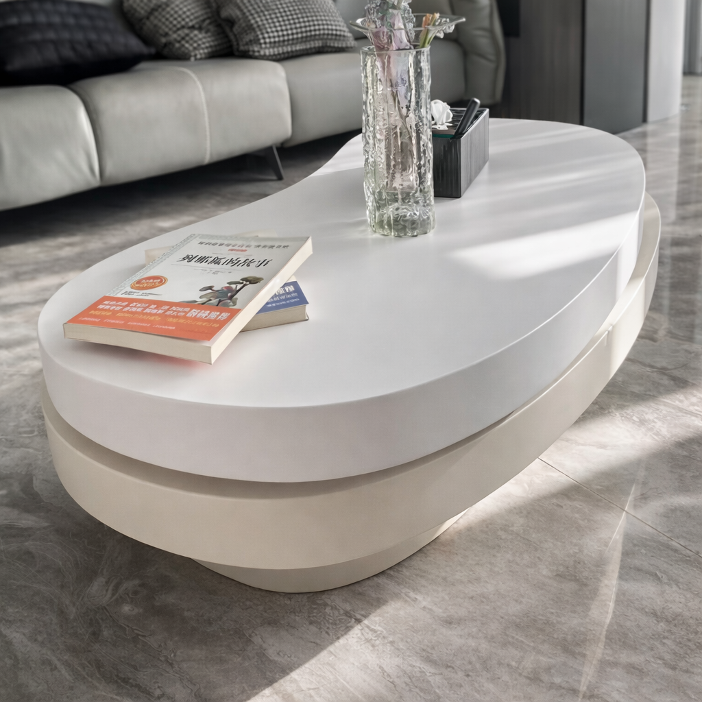 table basse salon ovale double plateaux blancs sur tapis clair plante tourne avec livres